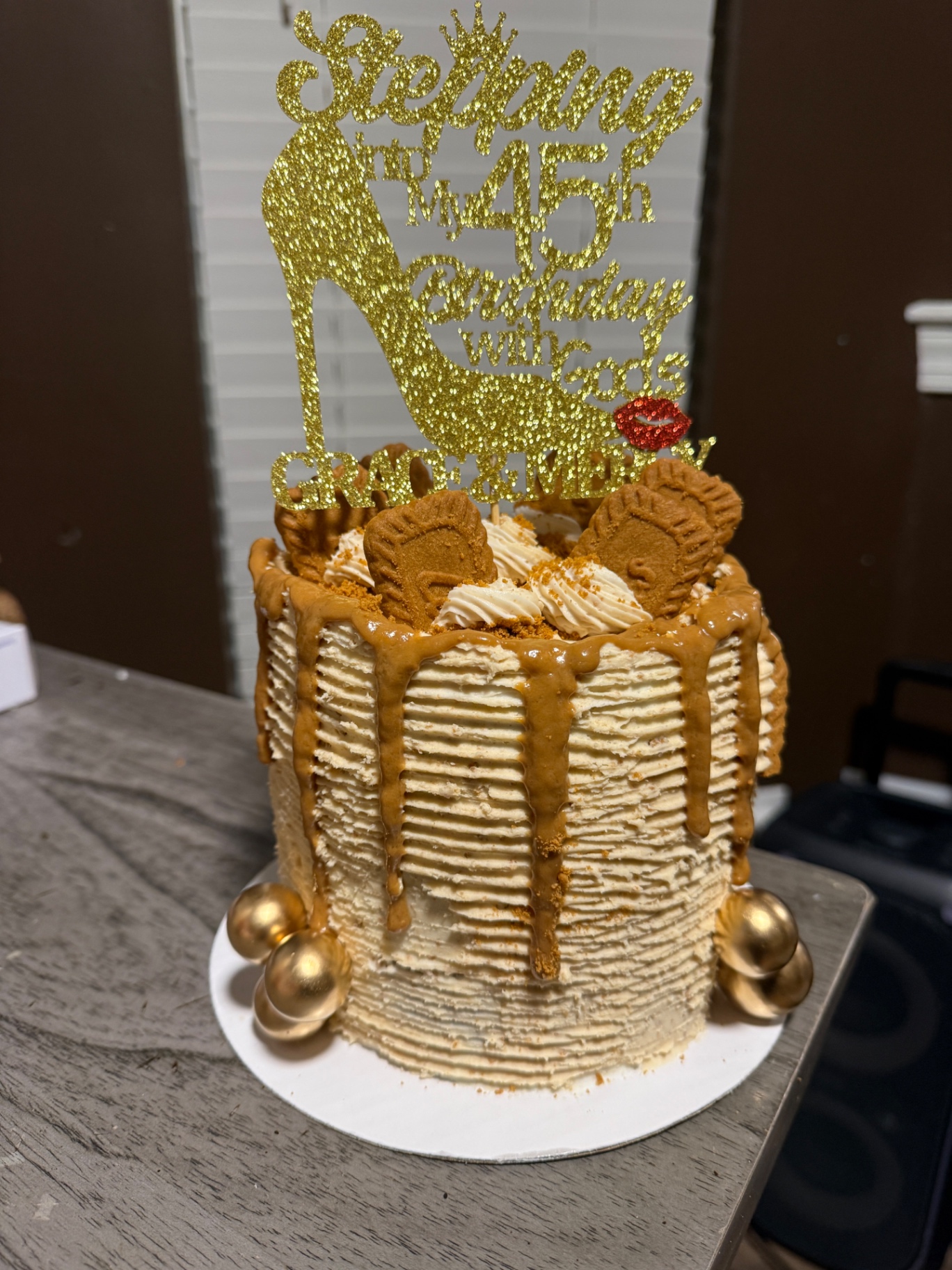 Biscoff drip cake with 45th birthday topper and cookies