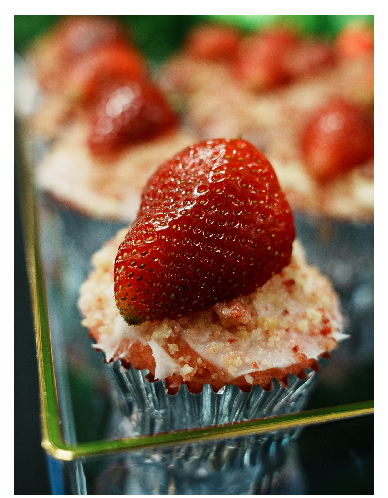 Strawberry shortcake cupcake with fresh strawberry on a crystal stand